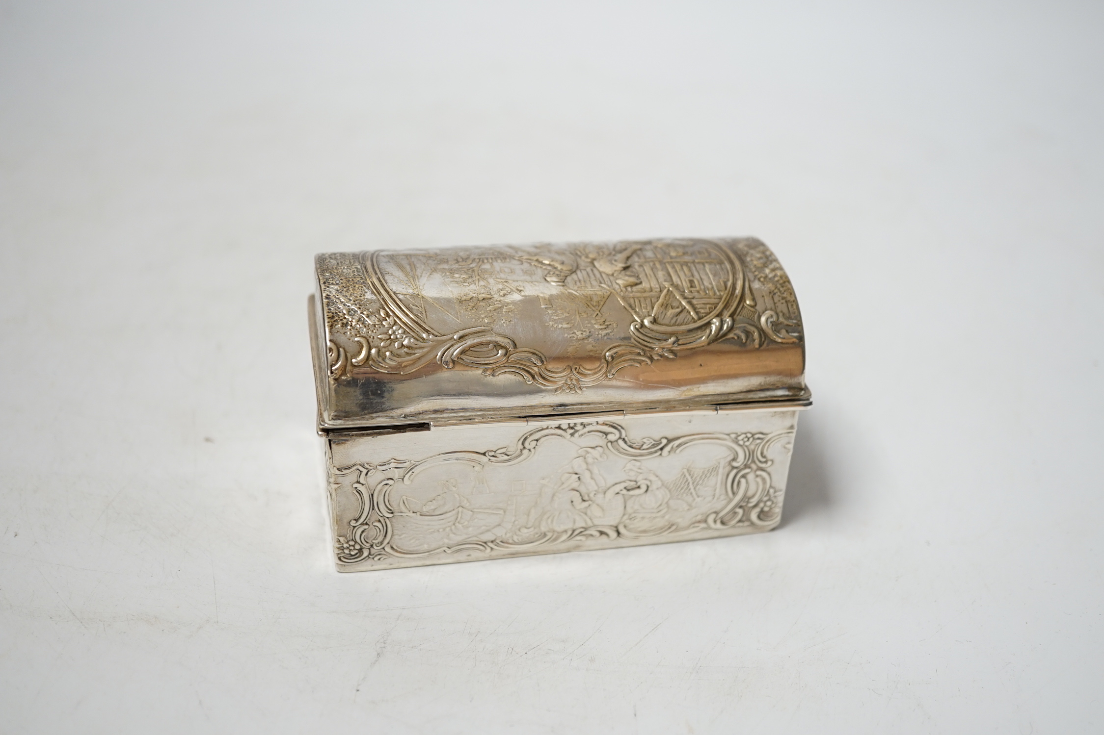 An early 20th century repousse Hanau silver box, modelled as a travelling trunk, import marks for Berthold Muller, Chester, 1903, width, 10cm.